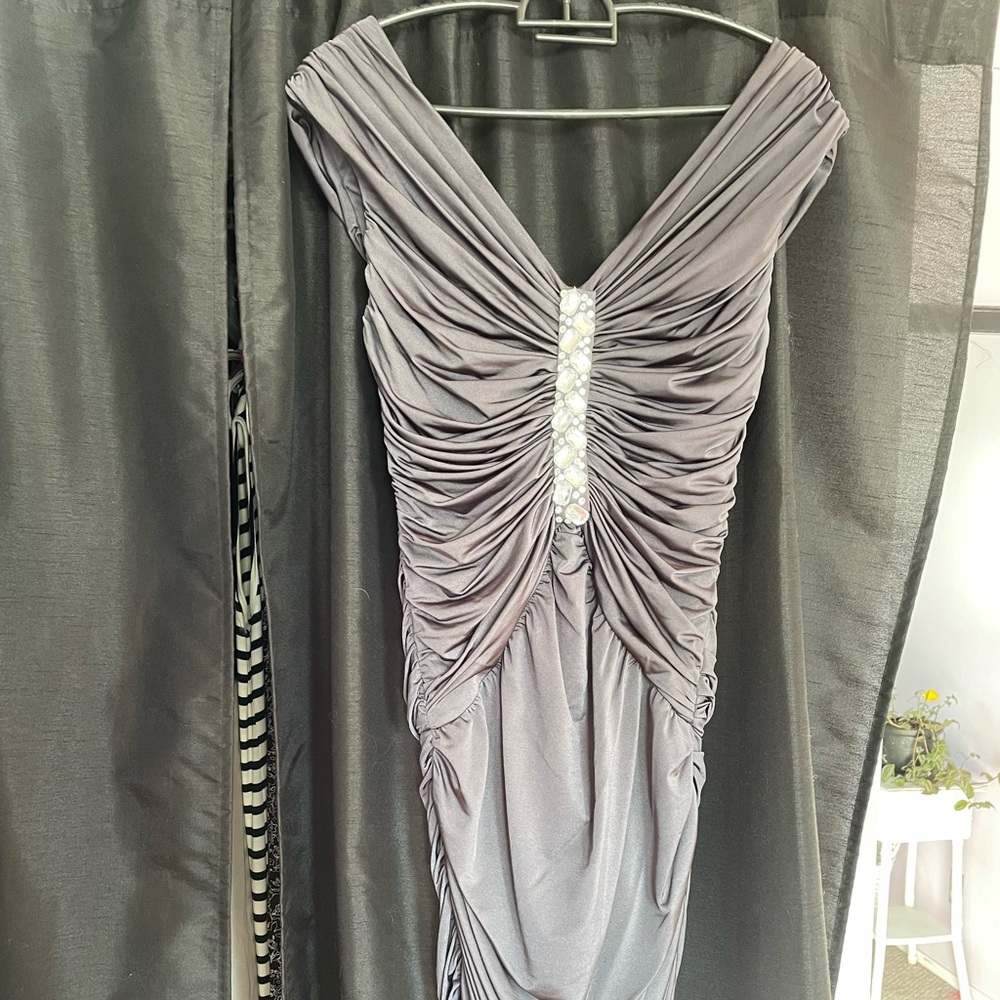 Worn once. Spectacular dress. Very flattering rich charcoal color and bling